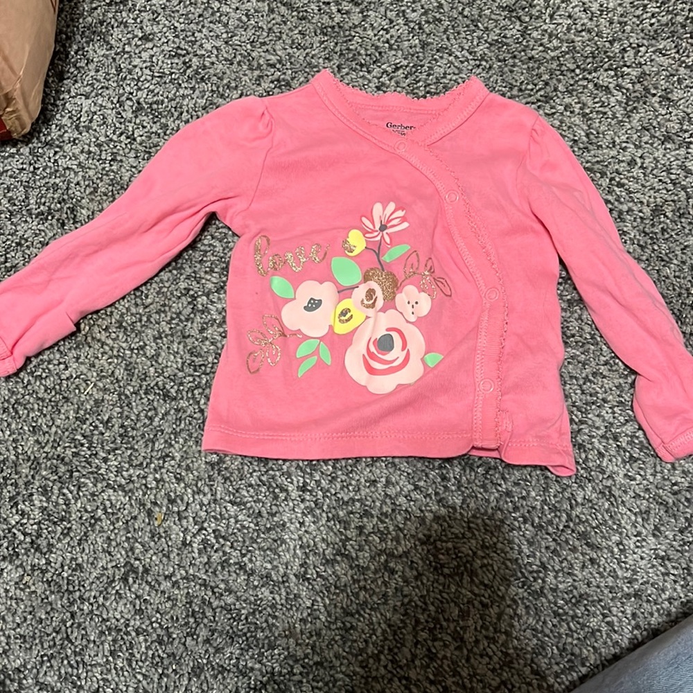 Pink button shirt.